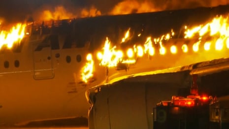 A Japan Airlines plane is on fire on the runway of Tokyo’s Haneda airport.