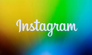 A screen displays the Instagram logo during a presentation in New York.