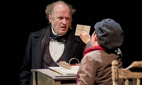 Canny entrepreneur … Adrian Edmondson (Scrooge) and Jasper Dance (Tiny Tim) in the RSC’s A Christmas Carol.