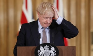 Boris Johnson clutches his head at a press conference on Covid, at Downing Street, on 14, 14 2021.