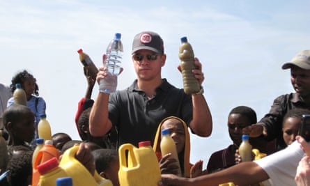 Matt Damon visits a well just outside Mekele, Ethiopia, in 2009. In his right hand he holds a bottle of regular water, in his left is a bottle of dirty water local children in Mekele drink every day