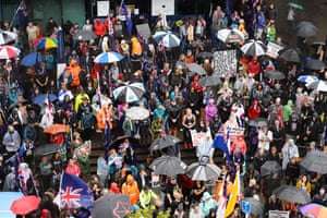 Members of the Freedom and Rights Coalition take part in a protest outside the police station in Christchurch, demanding an end to Covid restrictions and mandatory vaccination.