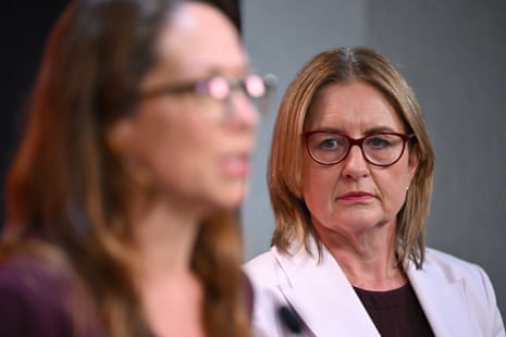 Victorian premier Jacinta Allan looks on as treasurer Jaclyn Symes speaks to media.