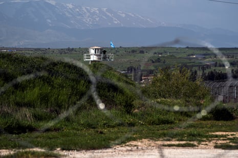 A U.N. peacekeeper guards at a post along the Israel-Syria border in the Israeli-occupied Golan Heights, April 2, 2024.