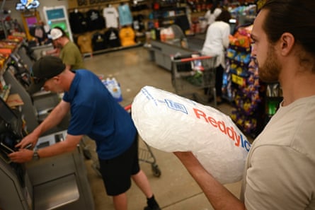 a person carrying ice