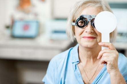 Senior female checking imagination pinch oculus trial glasses