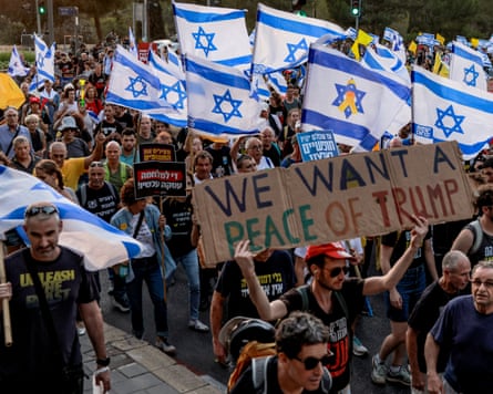 Crowd with banner saying We Want Peace of Trump and Israeli flags