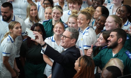 The Labour leader, Keir Starmer, takes a selfie with students after a campaign event at Three Counties medical school in Worcester.