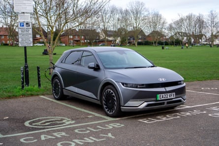 an EV charges in an electric charging bay