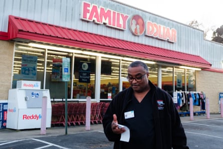 a person outside of a family dollar store