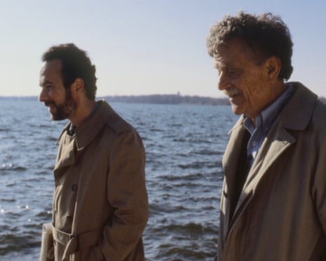Robert Weide and Kurt Vonnegut, in matching macs, walk by the coast