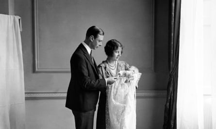 The Queen Mother (then the Duchess of York) with her husband, King George VI (then the Duke of York), and their daughter Princess Elizabeth at her christening