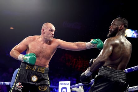 Tyson Fury lands a punch on Deontay Wilder in their 2020 bout