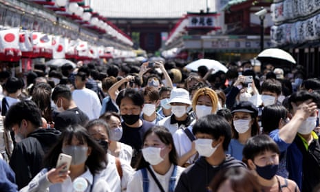 People wearing face masks at Asakusa Sensoji Buddhist temple in Tokyo