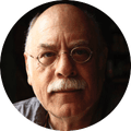 Robert Gluck, a portrait of a man with glasses