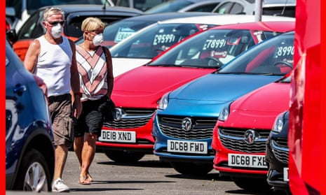 Would-be buyers pictured at Vauxhall Lookers in Speke, Liverpool, after car showrooms reopened for the first time since lockdown.