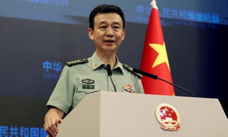 Wu Qian speaking at a press conference in 2023