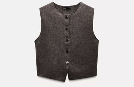 A dark grey waistcoat on a light grey background