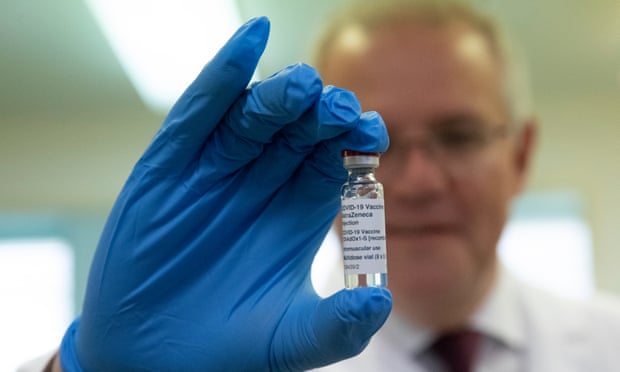 Scott Morrison holds a vial of the AstraZeneca Covid-19 vaccine during a tour of the Therapeutic Goods Administration in Canberra.