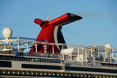 Close-up of the Carnival Panorama cruise ship's red and black whale-tail funnel