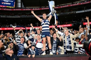 Cats captain Joel Selwood, now a four-time premiership winner and who kicked a goal late on in his 355th and possibly final game, celebrates with the joyous fans.