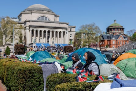 tents in front of the same columned and domed building, in a color photo