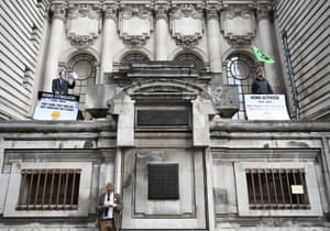 London, England. Activists affiliated with Extinction Rebellion demonstrate outside Methodist Central Hall, where Shell was scheduled to hold an annual general meeting
