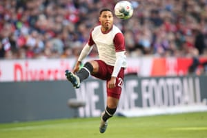 Serge Gnabry, in Bayern’s replica of their first shirts 120 years ago, looks to control the ball