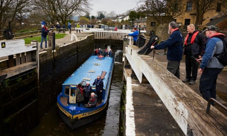 A canal boat passing through Bingley Five Rise locks