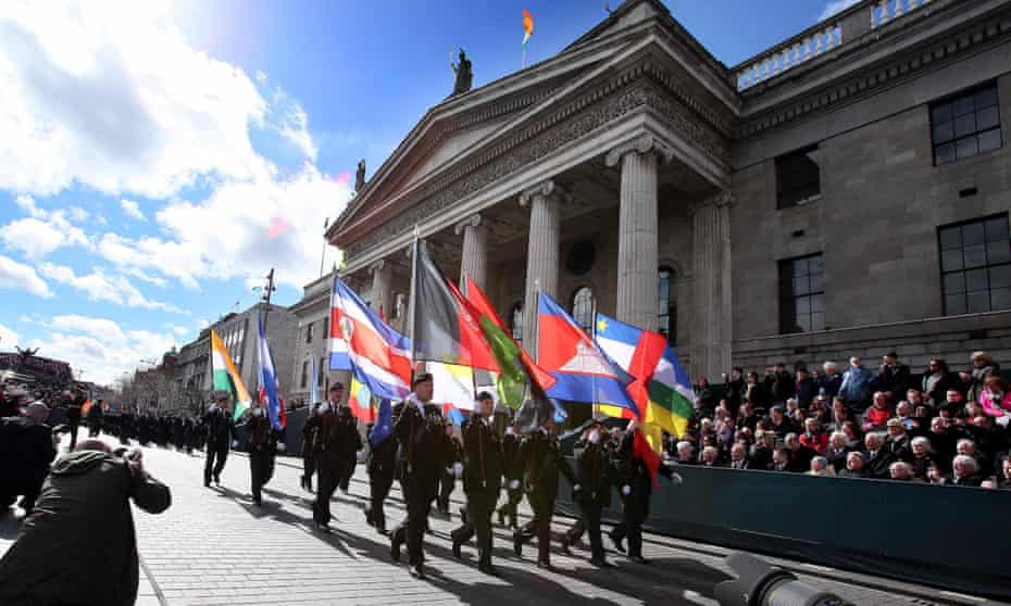 Members of the Irish army march past Dublin’s General Post Office, scene of the 1916 Easter Rising.