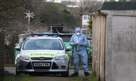 A forensics officer at the scene where the body of Lea Adri-Soejoko, 80, was found in a lock-up store at an allotment in Colindale, north west London.