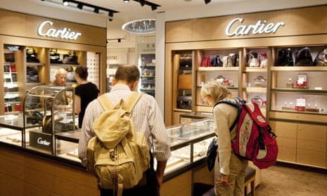 Shoppers browse Cartier jewellery at Heathrow airport