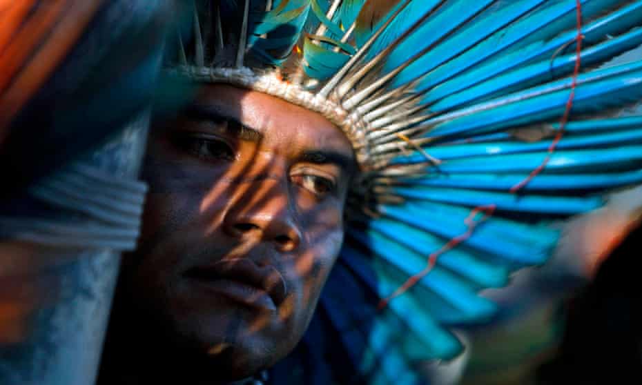 A South American Indian protests over land rights in Brazil. 