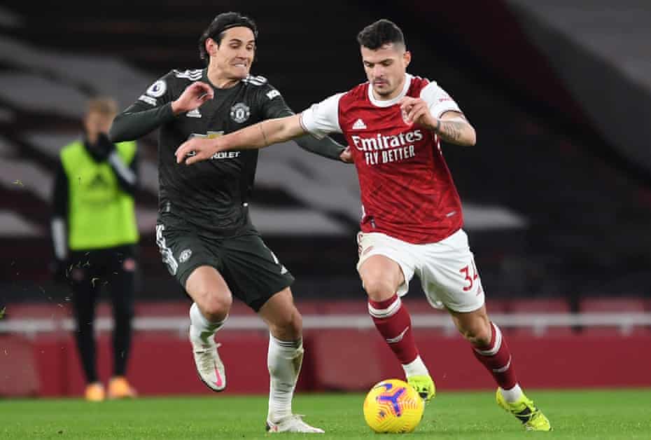 Granit Xhaka gets the better of Edinson Cavani during the draw with Manchester United last month.