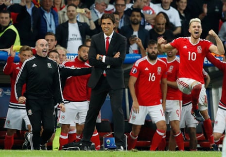 Chris Coleman and Aaron Ramsey celebrate at the final whistle.