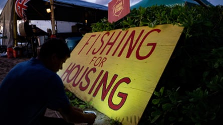A unpaid pinch Lahaina Strong sets up lights connected a protestation motion astatine Kaanapali formation successful Lahaina, Hawaii, connected 16 December 2023.