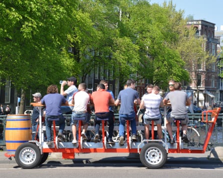 men on a stag do pictured on a beer bike in Amsterdam