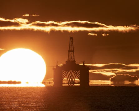 Sun rising behind a redundant oil platform moored in the Firth of Forth near Kirkcaldy, Fife.