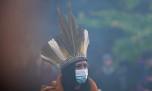 A Minga Indigena takes part in a fire ceremony