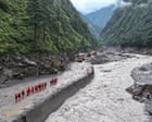 Flood risk forces halt to rescues in Tibet, as Nepal death toll rises to 469