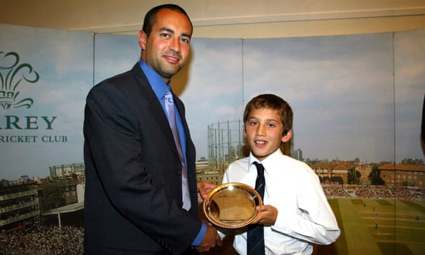 Ansari receives a Surrey youth cricket award from the former Surrey and England captain Adam Hollioake in 2003.