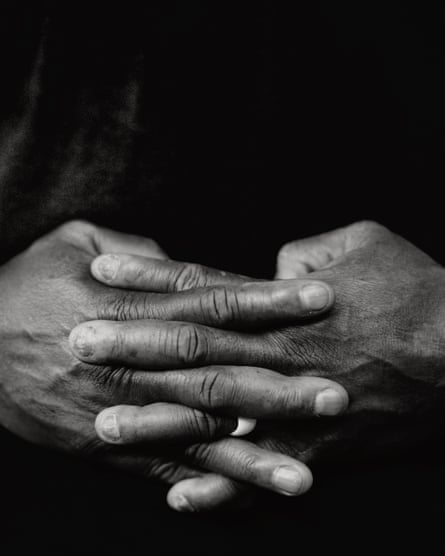 Alprentice Davis’s hands with fingers interlinked.