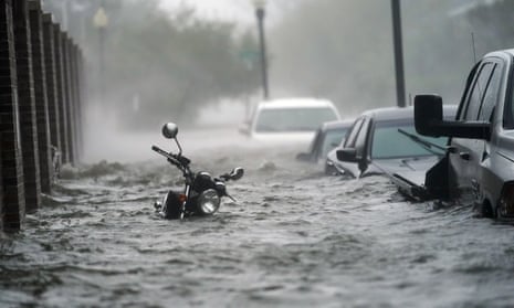 A picture of a motorcycle submerged in water as a result of Hurricane Sandy.
