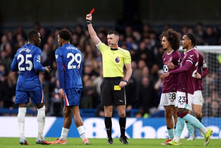 Chelsea's Wesley Fofana is shown a red card after a second yellow, as Burnley's Hannibal Mejbri looks on