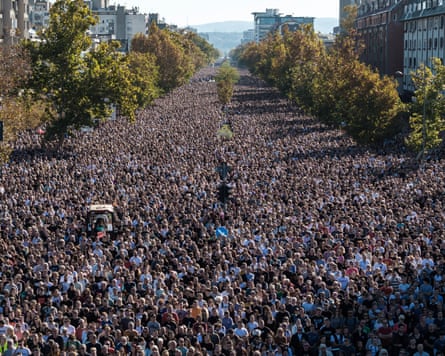 People stage a silent protest outside Novi Sad railway station to mark the first anniversary of the canopy collapse that killed 16 people, 1 November 2025.