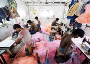 Employees work inside a garment factory in Mumbai, India. Some major brands have worked on reducing their environmental and social impact in manufacturing. But critics say there’s a lot more that needs to be done.