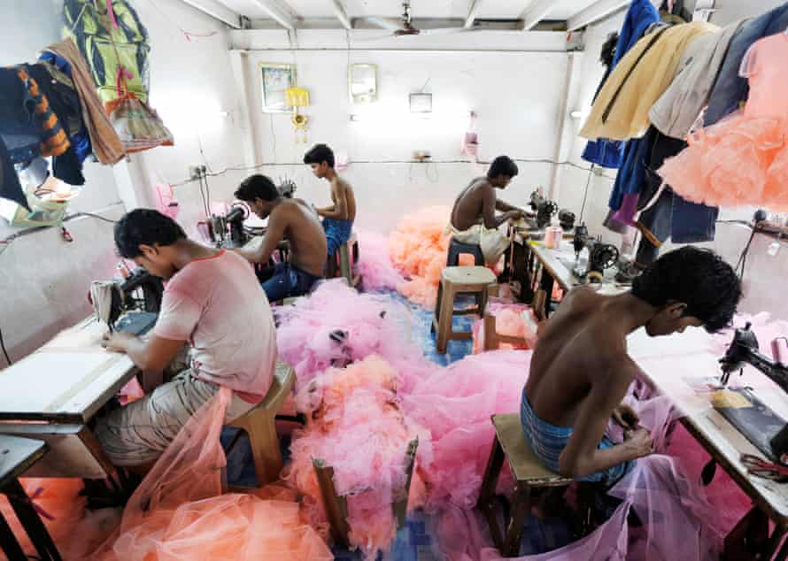 Employees work inside a garment factory in Mumbai, India. Some major brands have worked on reducing their environmental and social impact in manufacturing. But critics say there’s a lot more that needs to be done.