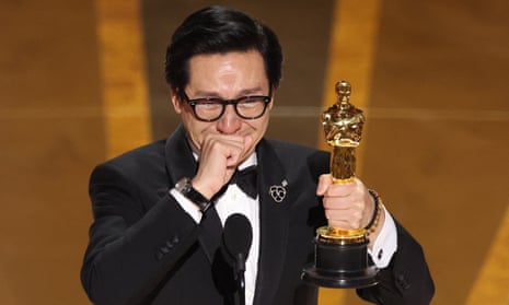Ke Huy Quan accepts the Oscar for best supporting actor. 