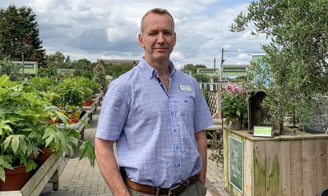 James Evans standing outside his garden centre