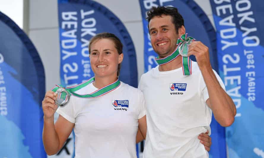 Anna Burnet and John Gimson proudly display their silver medals after the Ready Steady Tokyo Olympic Test event at Enoshima Yacht Harbor in Kanagawa, Japan.